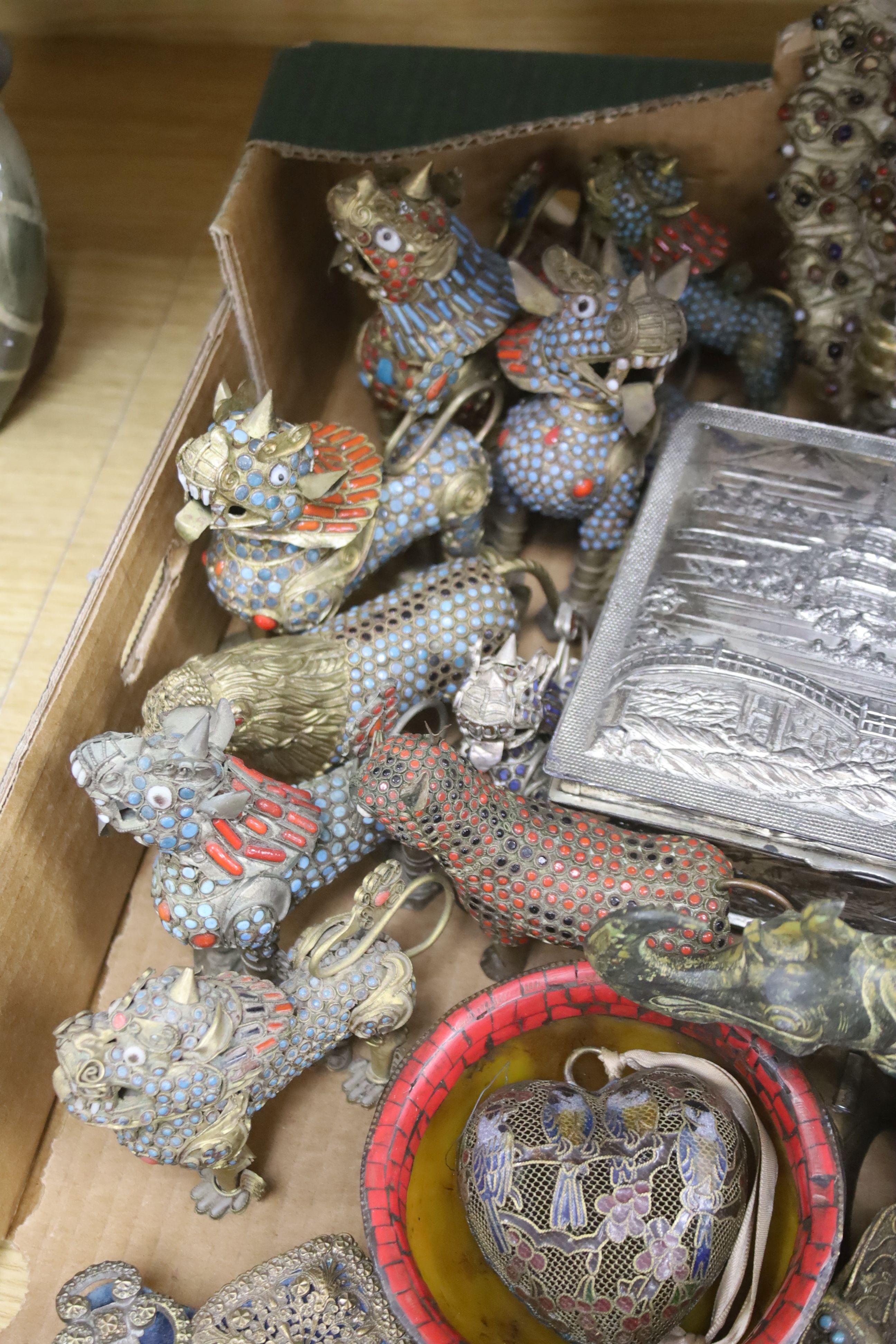 A group of Tibetan style metalware figures, masks, ornaments, etc.